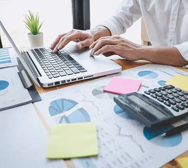 Man working on laptop about us